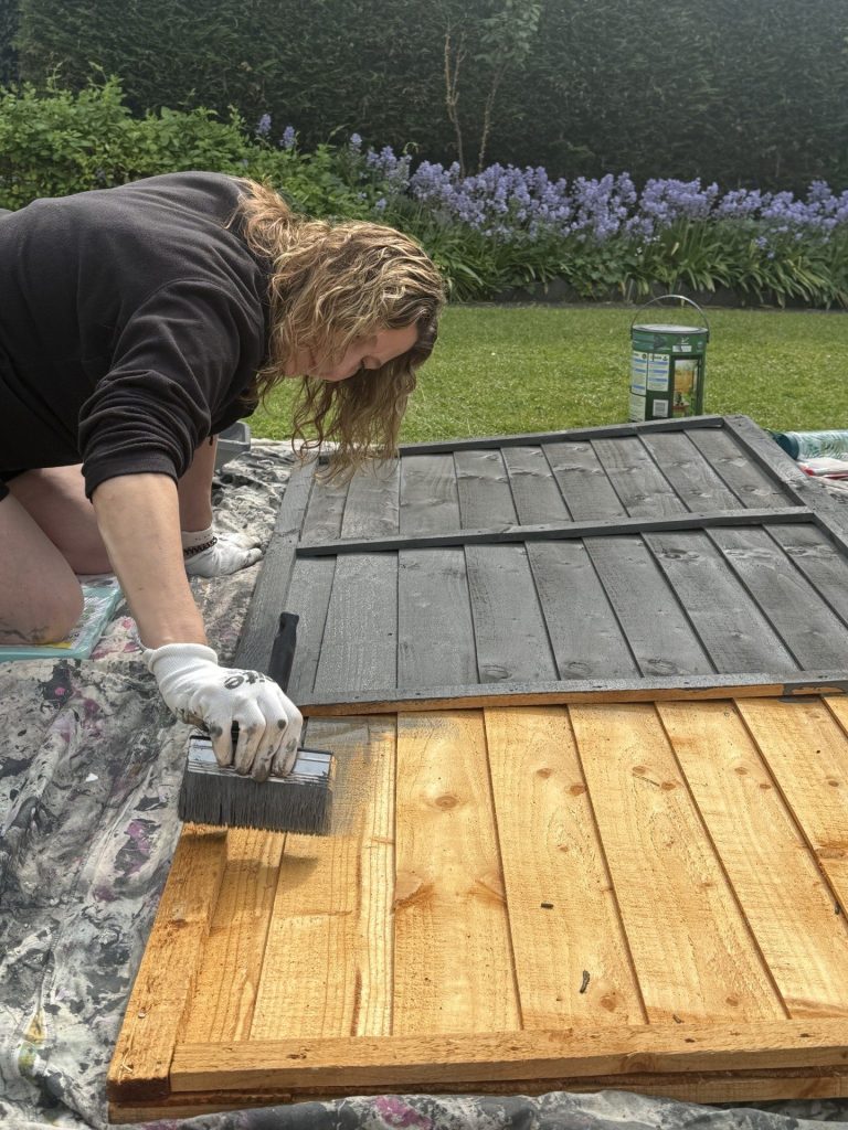Preparing and painting new fence panels